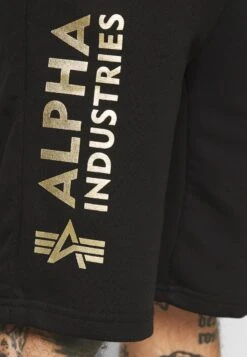 Alpha Industries BASIC FOIL PRINT - Jogginghose - Black/yellow Gold -Alpha Industries 6c49dd22717748459ad776656c0bd3ef